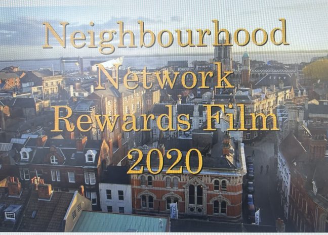 City skyline overlaid with large gold text reading 'Neighbourhood Network Rewards Film' and the year '2020' in the foreground.